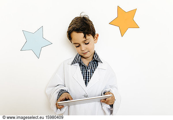 Boy with clipboard playing researcher