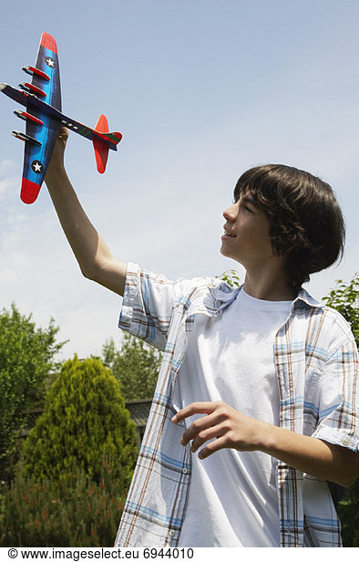 Boy with Toy Plane