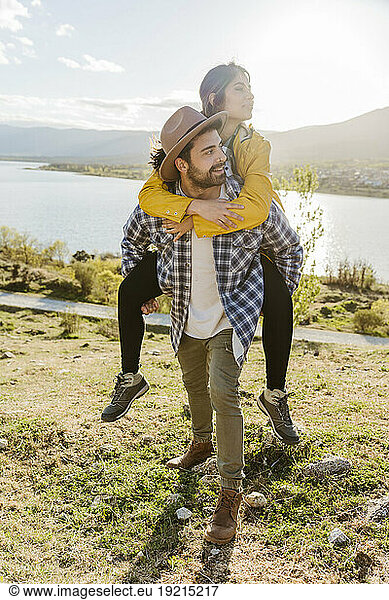 Boyfriend giving piggyback ride to girlfriend