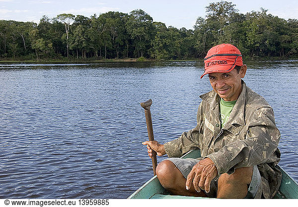 Brazilian Man in Canoe