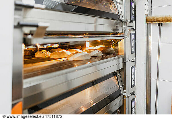 Bread baking bread in oven at commercial kitchen