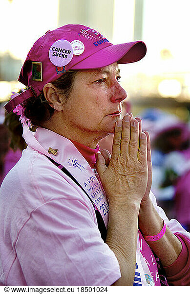 Breast cancer survivor is moved to tears during a breast cancer walk in New York City.