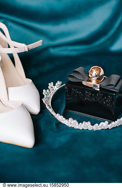 Bridal accessories. Bridal shoes  perfume and crown.