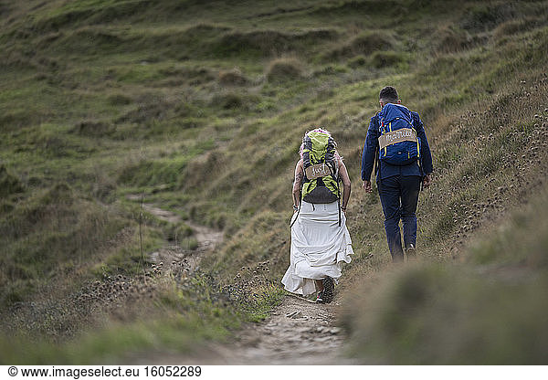 Bridal couple with climbing backpacks at Urkiola mountain  Spain