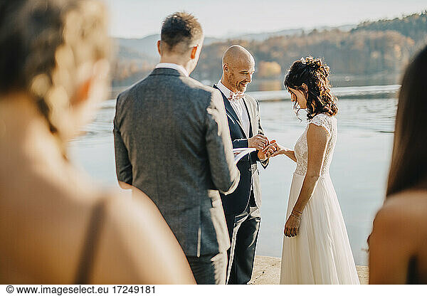 Bride and groom exchanging wedding rings during ceremony