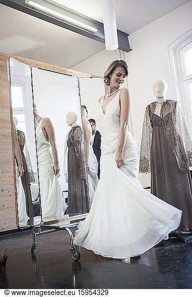 Bride fitting her dress in studio