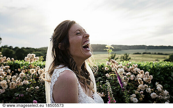 bride on her wedding day laughing