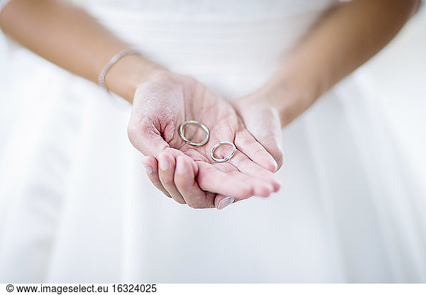 Brides maid holding wedding rings