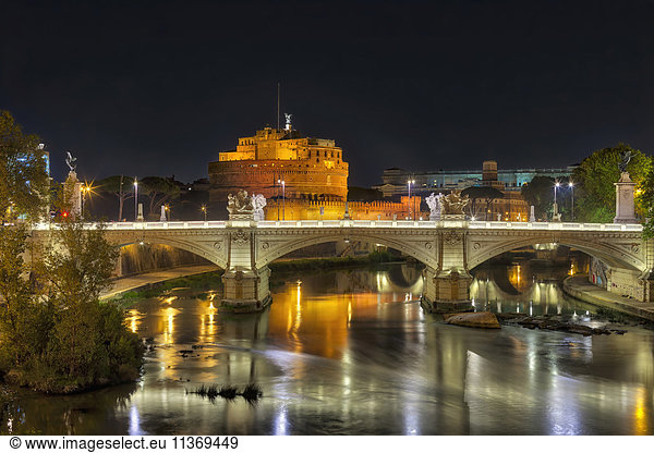 Bridge and Ponte SantAngelo illuminated at night  Rome  Italy