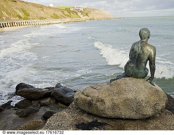 Bronze statue of a mermaid by Cornelia Parker gazing over the horizon  Folkestone Harbour; Folkestone  Kent  England