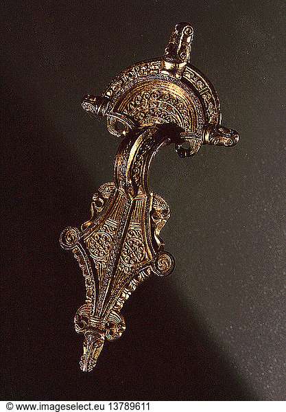 Brooch richly decorated with animals  human beings and gilt details  Such artefacts had not only an everyday practical use  but as they were mostly exchanged as gifts  had a symbolic significance demonstrating the importance of the owners contacts. Sweden. Viking. Migration period.