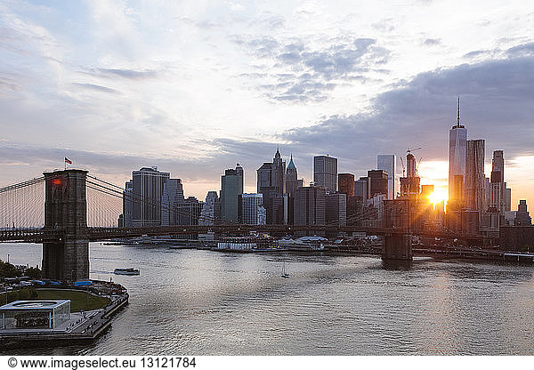 Brooklyn Bridge over East river in New York city during sunset