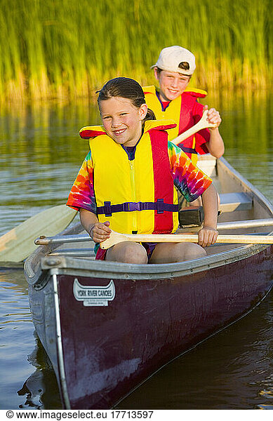 Brother And Sister In Canoe