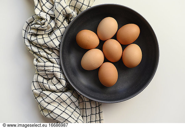 Brown Chicken Eggs in Black Bowl