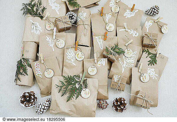 Brown paper bags with decorations kept on carpet