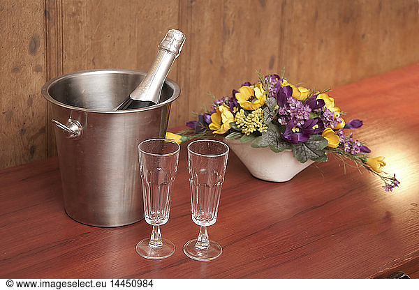 Bucket With Champagne and Two Glasses
