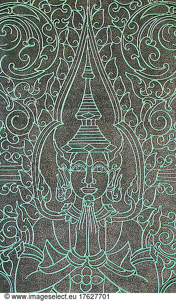 Buddha figure engraved into the Victory Gate at the Royal Palace.