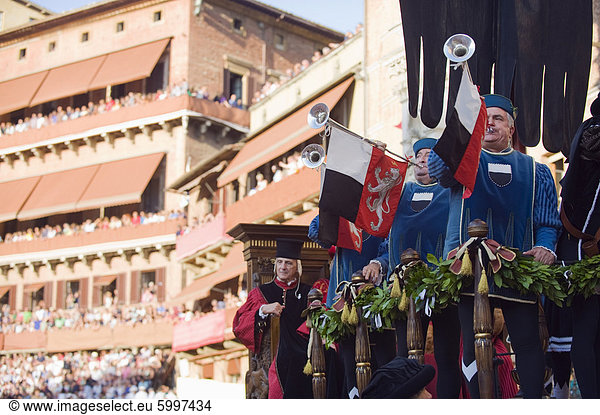 Bugle player in a parade at El Palio horse race festival  Piazza del Campo  Siena  Tuscany  Italy  Europe