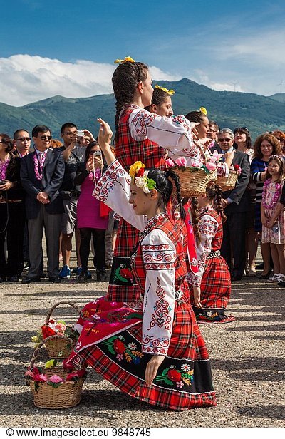 Bulgaria  Central Mountains  Kazanlak  Kazanlak Rose Festival  town produces 60% of the world's rose oil  dancers in traditional costume at the rose harvest dance  NR.