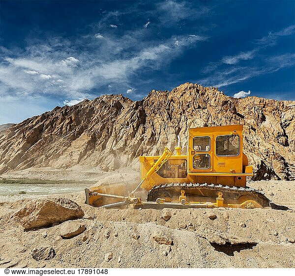 Bulldozer doing road construction in Himalayas. Ladakh  Jammu and Kashmir  India  Asia