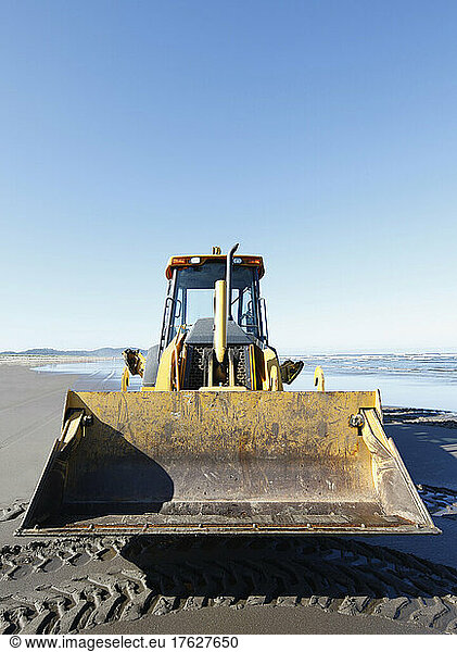 Bulldozer on a sandy beach.