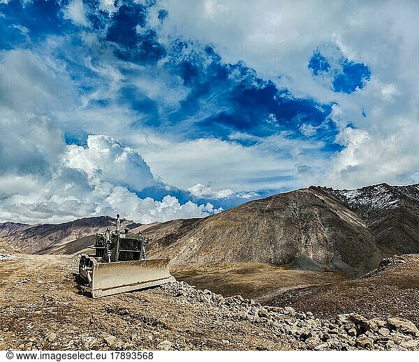 Bulldozer on road in Himalayas. Ladakh  Jammu and Kashmir  India  Asia