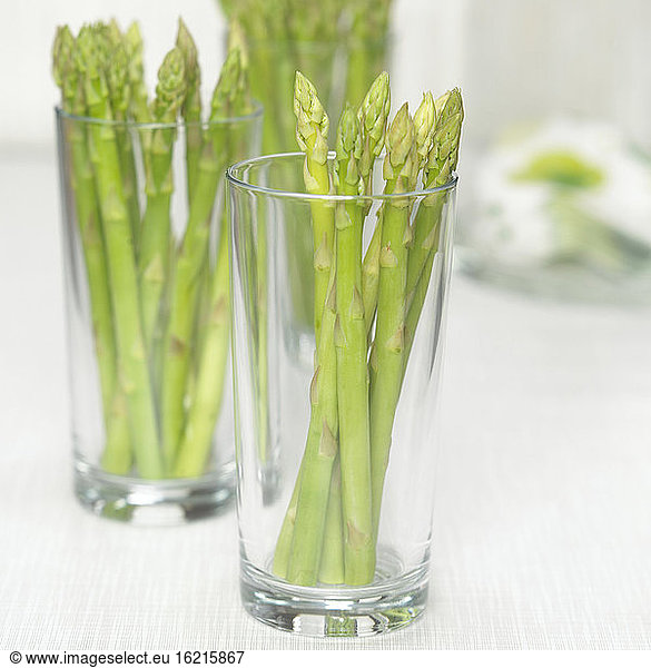 Bundle of asparagus in glass  close-up