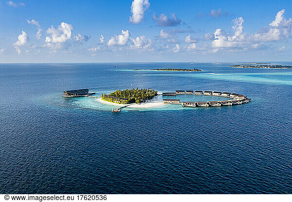 Bungalows surrounded by blue sea view at Kudadoo island  Maldives