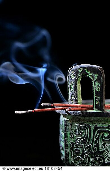 Burning incense sticks on incense burner  aromatherapy  fragrance
