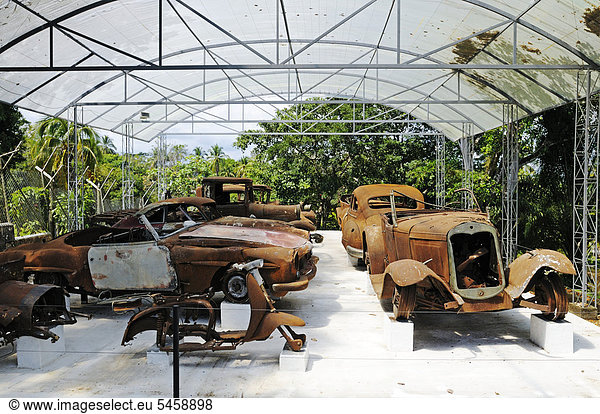 Burnt out cars  fleet  Museum at the Hacienda Napoles  former estate of drug baron Pablo Escobar  head of the Medellin Cartel  Puerto Triunfo  Antioquia  Colombia  South America