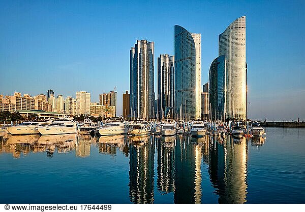Busan marina with yachts  Marina city skyscrapers with reflection on sunset  South Korea