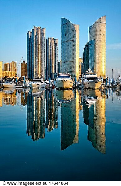 Busan marina with yachts  Marina city skyscrapers with reflection on sunset  South Korea