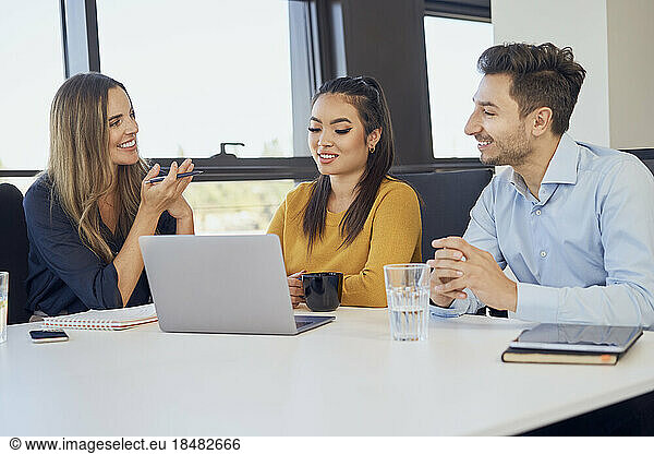 Business colleagues discussing in meeting at workplace