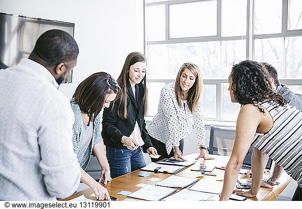 Business people brainstorming in board room