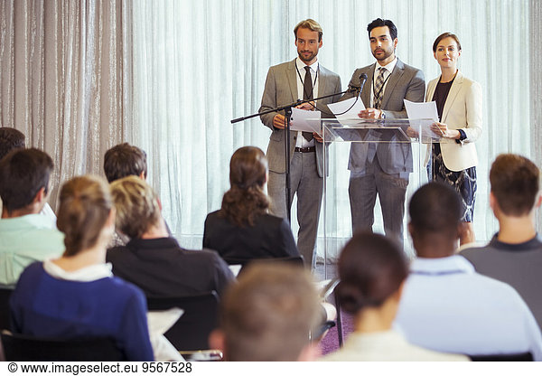 Business people giving presentation in conference room