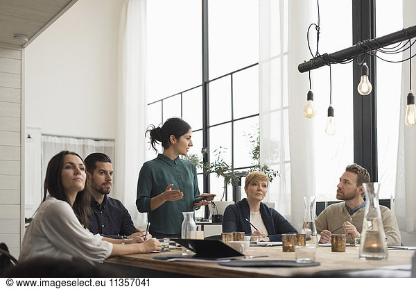 Business people in meeting at table in office