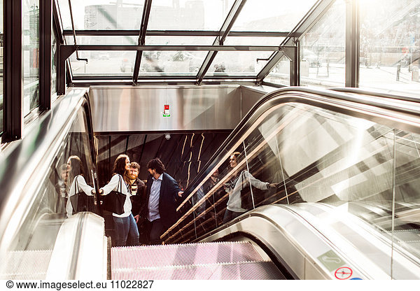 Business people on escalator at central station