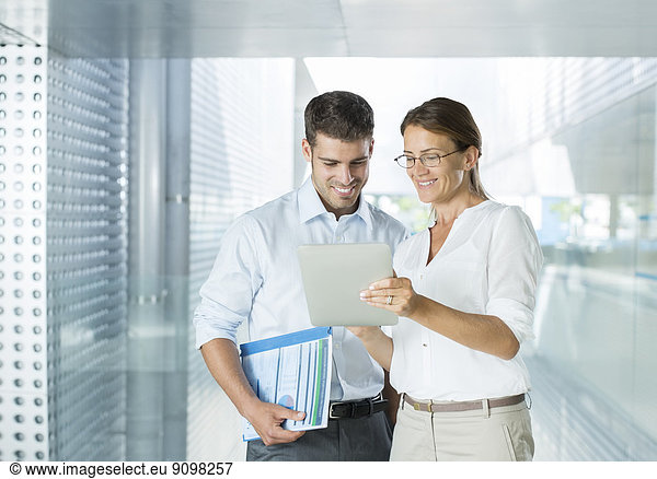 Business people using digital tablet in office