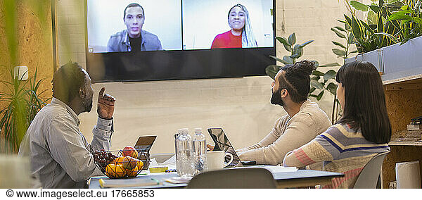 Business people video conferencing in office meeting