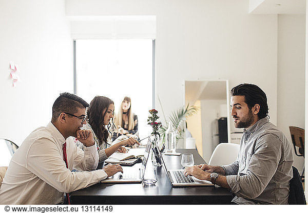 Business people working at desk in office