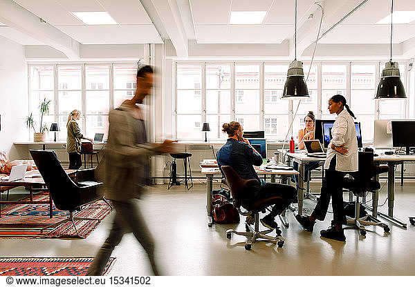 Business professionals working in creative office