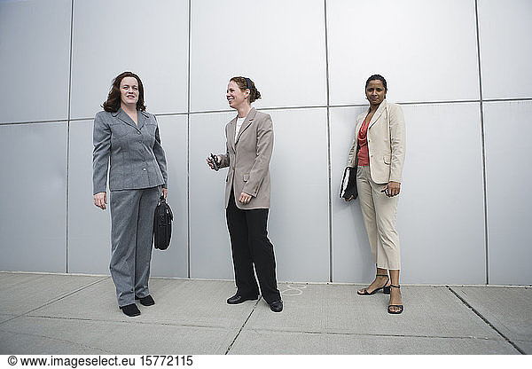 Business women standing outside an office