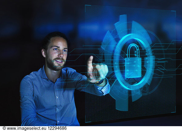 Businessman accessing security feature on futuristic hologram computer