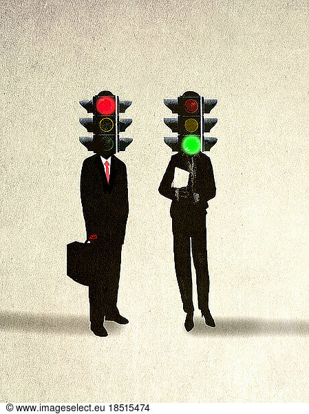 Businessman and businesswoman with traffic signals on head against beige background