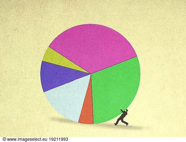 Businessman being rolled over by oversized pie chart