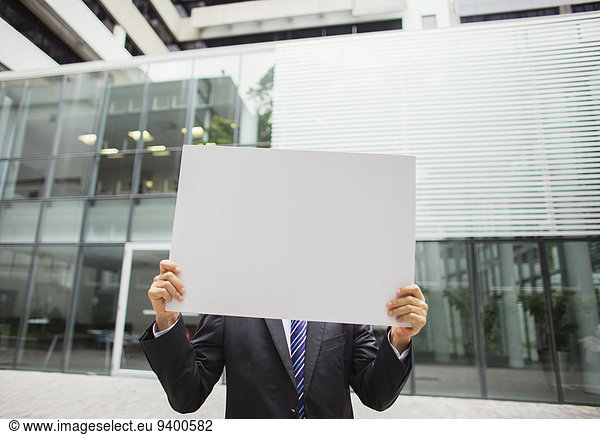 Businessman holding document in office building