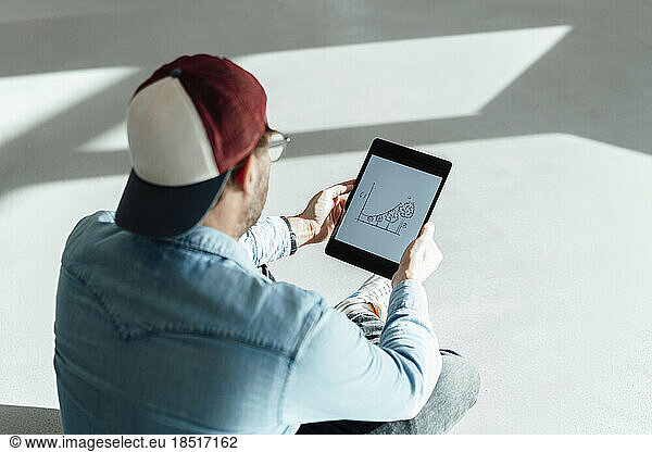 Businessman looking at graph chart on tablet PC