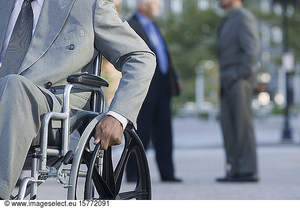 Businessman on wheelchair  mid section