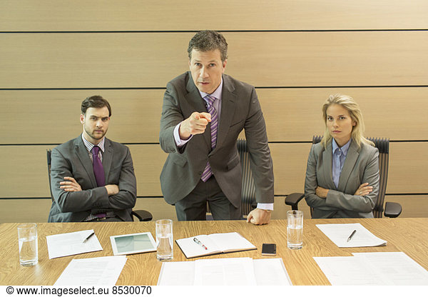 Businessman shaking his finger in meeting