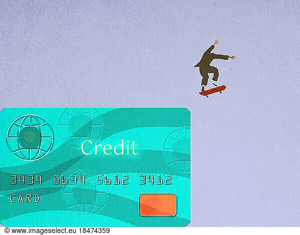 Businessman skateboarding off oversized credit card